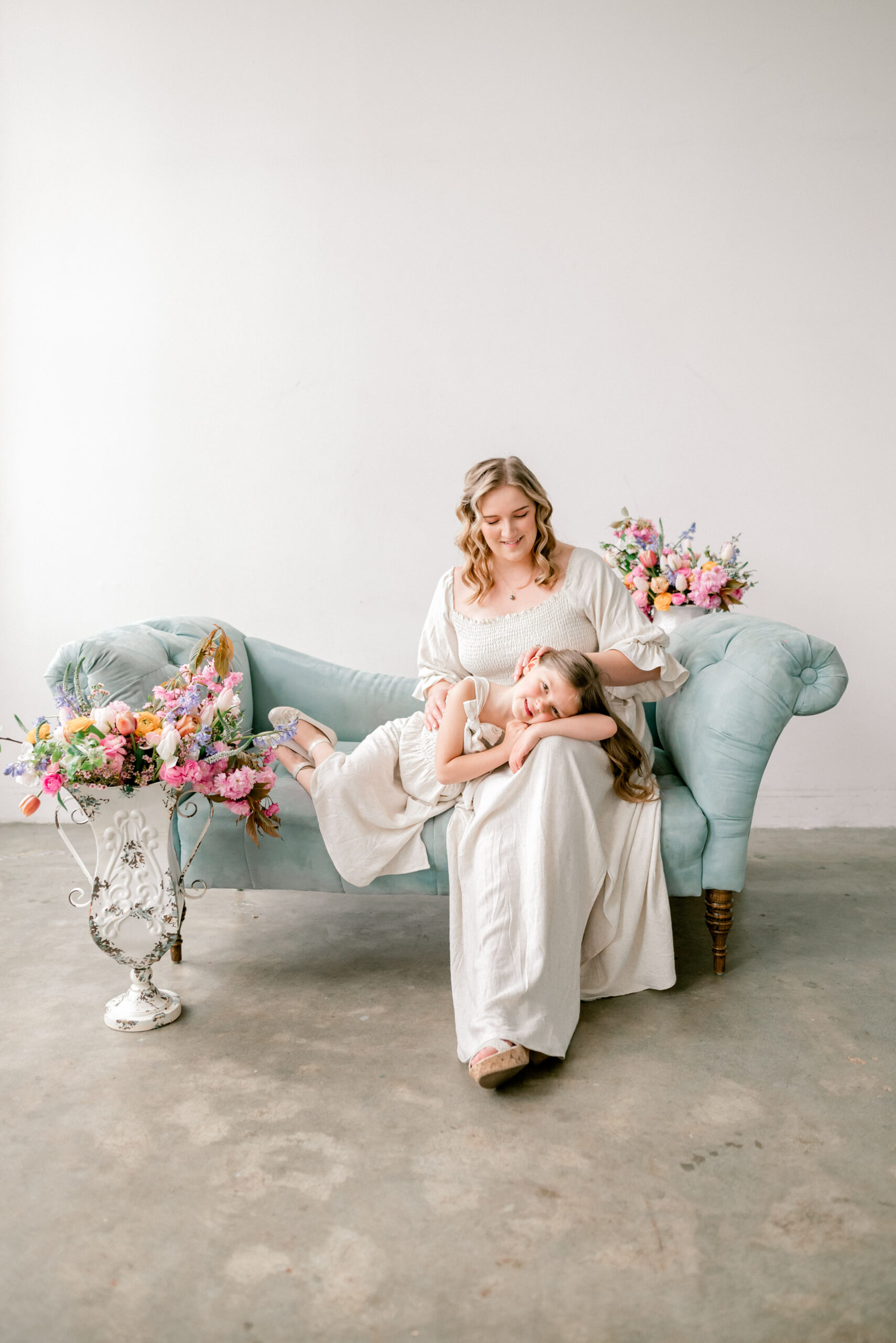 motherhood portrait session with mother and daughter in cream color dresses