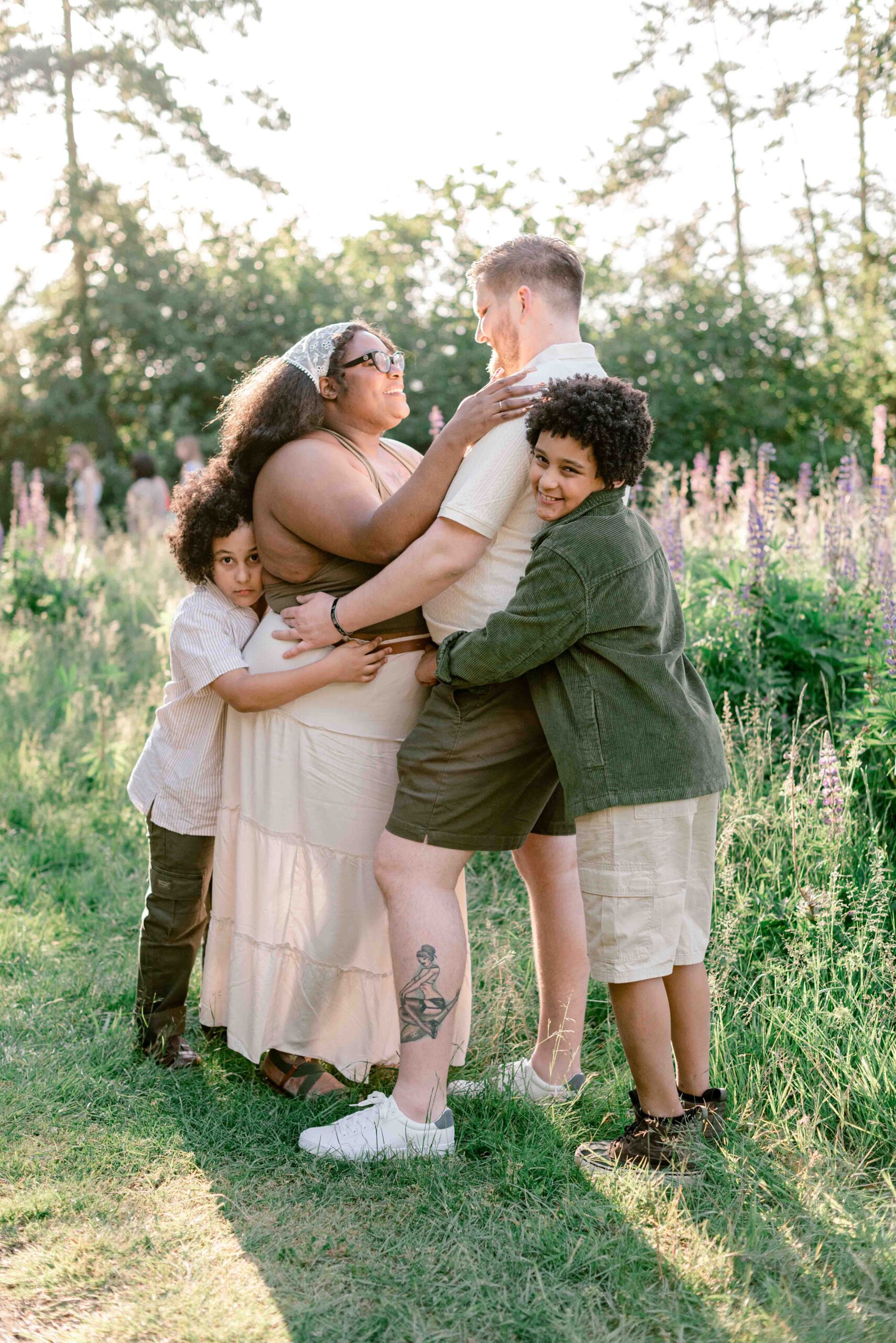 family of four pose for family photoshoot at Discovery Park